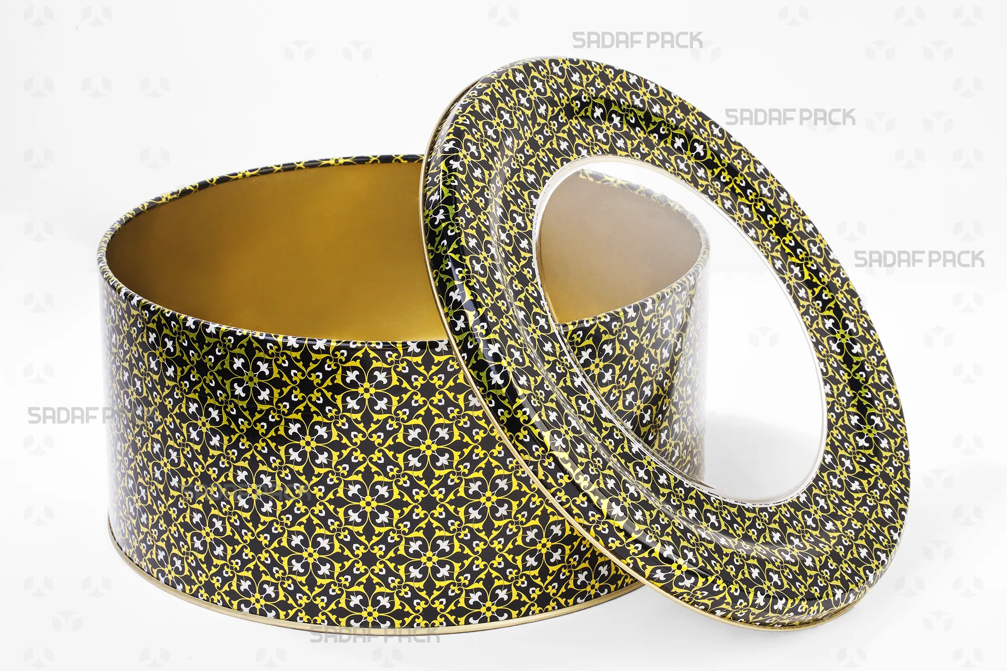 نمای بالا از قوطی فلزی خالی 23 در 10 سانت طرح مشکی طلایی سفید صدف پک، درب باز است و عمق و فضای داخلی قوطی دیده میشود.